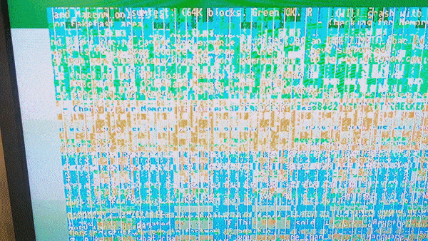 Animated loop showing the Amiga 3000 running DiagROM with display corruption, including garbled characters, overwriting of the screen buffer, and colour changes