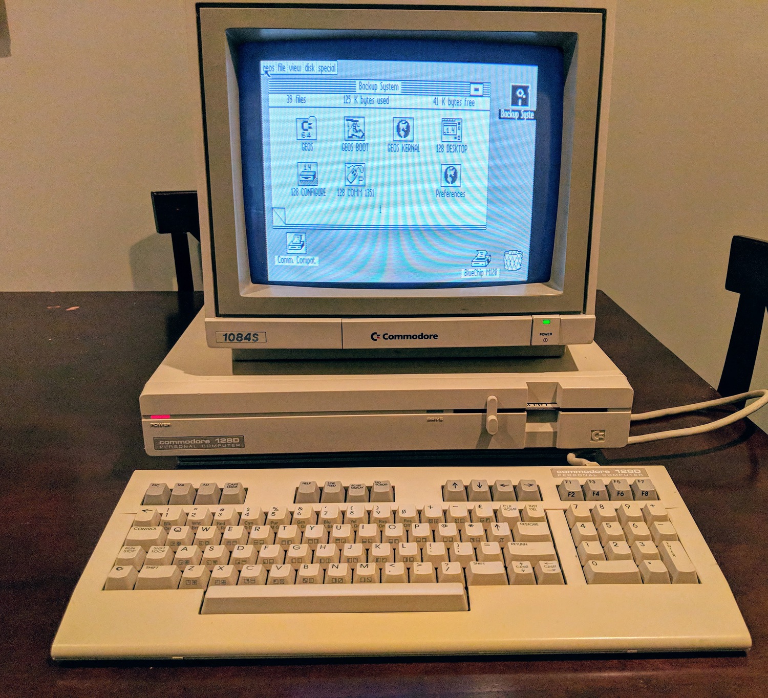 Commodore 128D, powered up with a 1084S monitor running GEOS 128