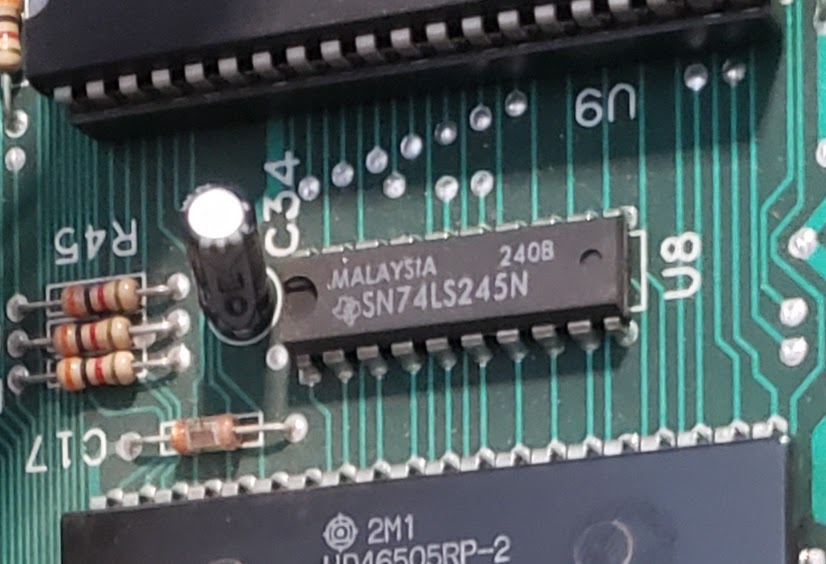 Close up of a TI SN74LS245N at position U8 on the Commodore B128 logic board