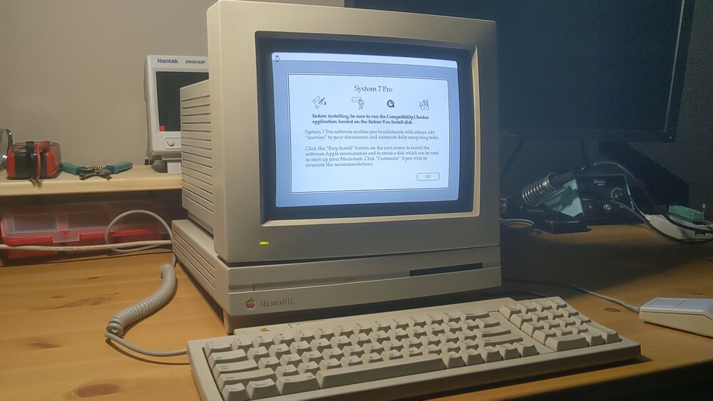 Macintosh LC with monitor, keyboard, and mouse showing the System 7 installer